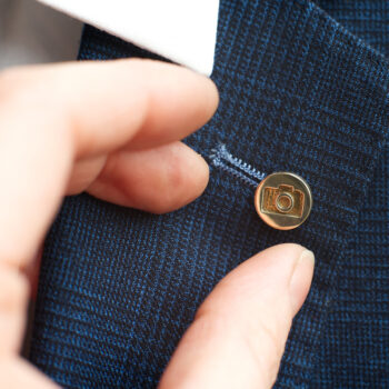 Brass lapel pin Millet Wade